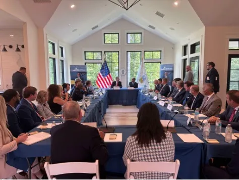 Wittman and others in a meeting